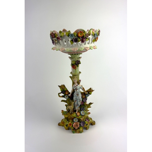 91 - A 19th century continental porcelain centrpiece, the pierced basket encrusted with flowers, raised o... 