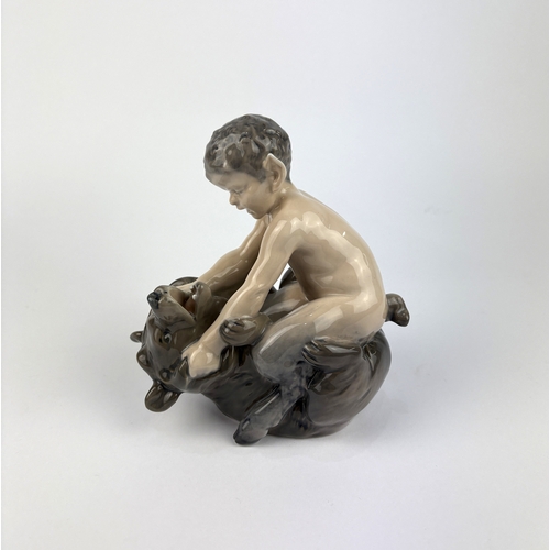 99 - A Royal Copenhagen porcelain model of a faun with a bear no 648 16cm high... 