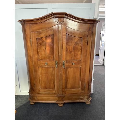 1086 - An 18th/19th century German inlaid walnut armoire, the two panelled doors applied with ornate cast g... 