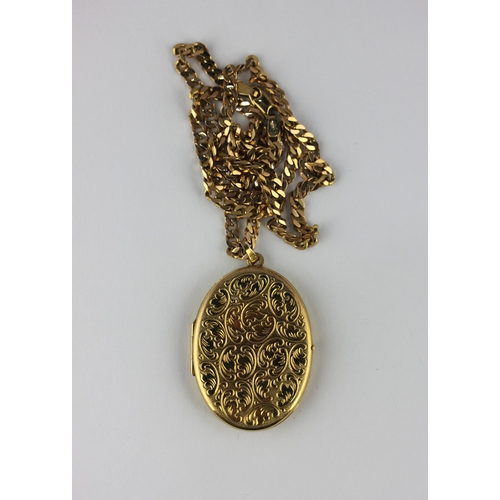 140 - A 9ct gold oval pendant locket with scroll engraved decoration with a 9ct gold faceted curb link nec... 