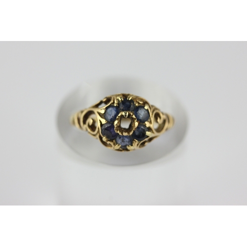 143 - A Victorian gold and sapphire ring mount (centre stone missing) with scroll pierced shoulders, unmar... 