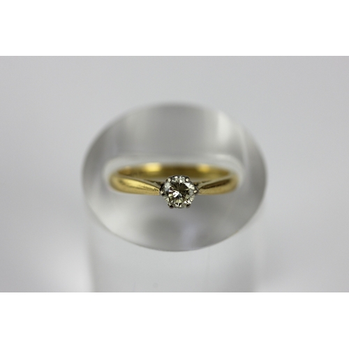 155 - A gold and platinum diamond single stone ring, claw set with a circular cut diamond, detailed 18 PLA... 