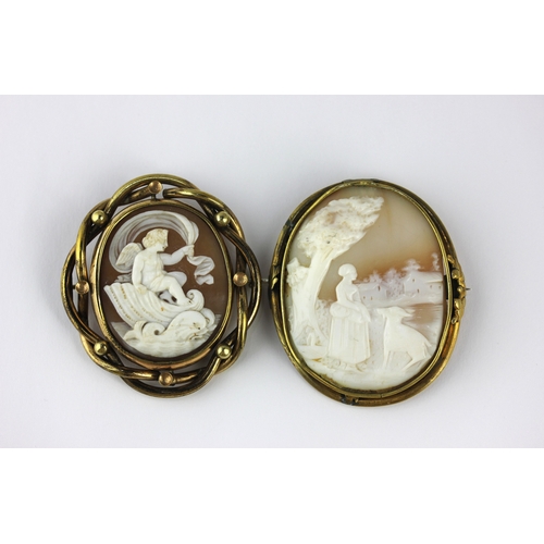 163 - A Victorian gilt metal mounted oval shell cameo brooch designed as a cherub, a dolphin and a seashel... 
