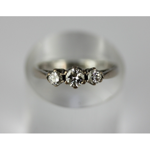 167 - A diamond three stone ring claw set with a row of circular cut diamonds size P and 1/2 gross weight ... 