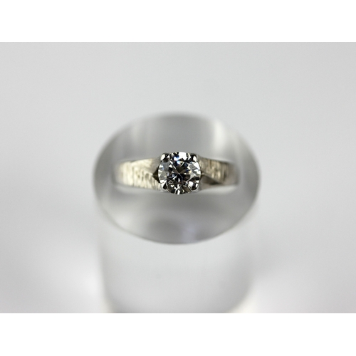17 - A 9ct white gold and synthetic colourless gem set solitaire ring with decorated shoulders, size M, g... 