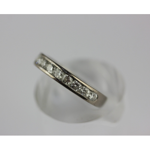 172 - An 18ct white gold and diamond half hooped ring mounted with a row of twelve brilliant cut diamonds,... 