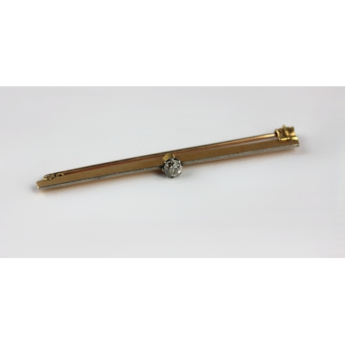 173 - A gold and platinum fronted bar brooch claw set with an old cut cushion-shaped diamond, length 6.5 c... 