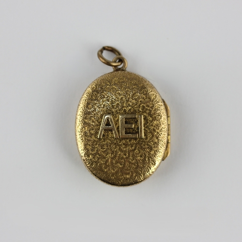 24 - A Victorian gold oval pendant locket detailed AEI otherwise with an inscription relating to the Hitc... 