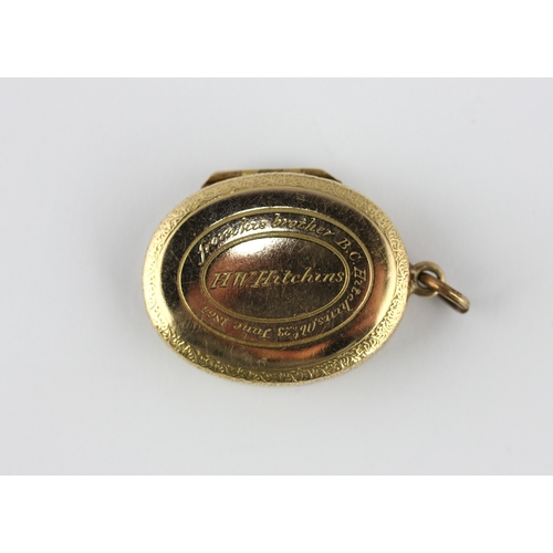 24 - A Victorian gold oval pendant locket detailed AEI otherwise with an inscription relating to the Hitc... 