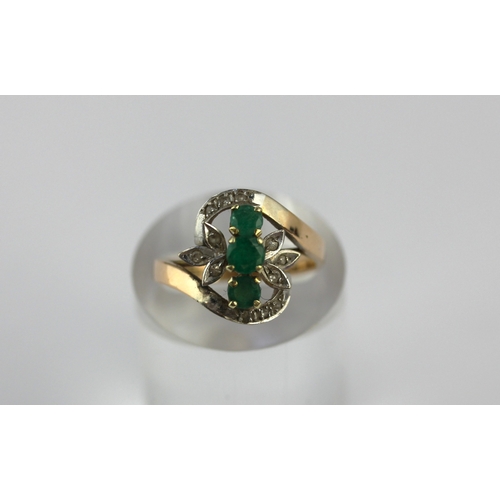 3 - A gold ring set with three circular cut emeralds and with small diamonds, detailed 14k 585, size N ½... 
