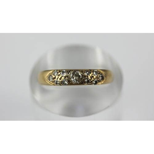 33 - A gold and diamond ring set with the principal circular cut diamond at the centre, detailed '9ct', s... 