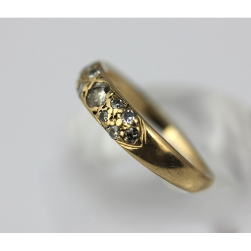 33 - A gold and diamond ring set with the principal circular cut diamond at the centre, detailed '9ct', s... 