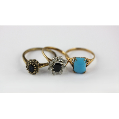 34 - Three gold and gem set rings comprising a 9ct gold diamond and blue gem set oval cluster ring size Q... 