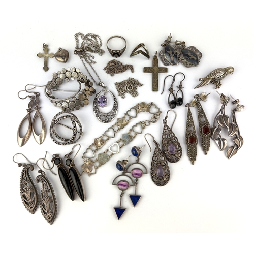 37 - A group of mostly silver jewellery comprising nine pairs of earrings, two neckchains, a heavy link b... 