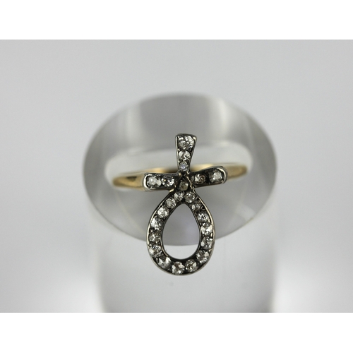 40 - A gold and diamond ring designed as an Egyptian Ankh   detailed 18ct size S gross weight 2.1g ... 