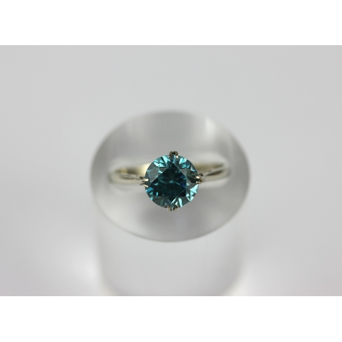 41 - A white gold ring claw set with a circular cut blue zircon, detailed 9ct, size M, gross weight 2g ... 