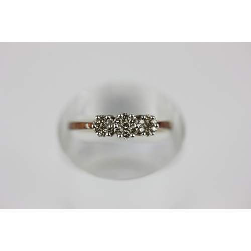 49 - A 9ct gold and diamond ring in a triple cluster design, ring size M and a half and gross weight 2.2g... 