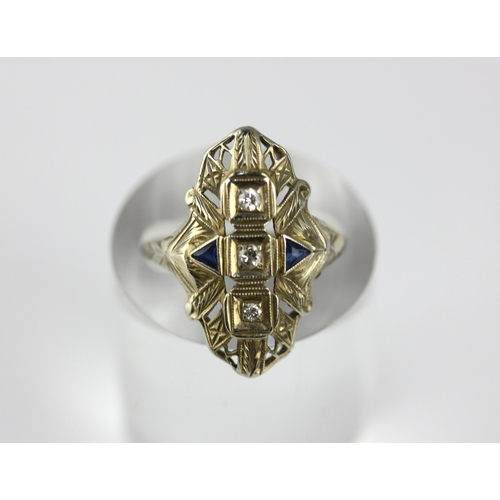 52 - A diamond and synthetic sapphire set panel shaped ring, set with three circular cut diamonds, size M... 