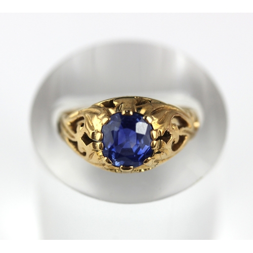53 - A gold ring, claw set with an oval cut sapphire with pierced decoration, unmarked, size K, gross wei... 