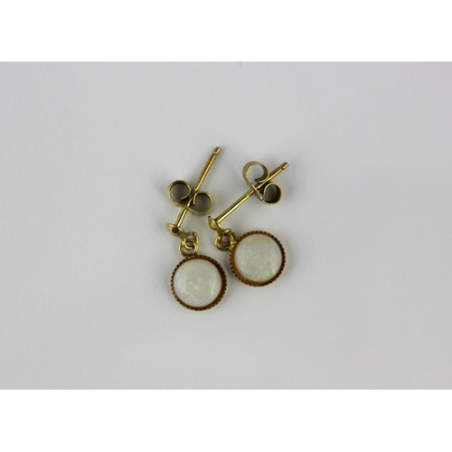 55 - A pair of gold and opal single stone pendant earrings each detailed 9ct, with gold post and butterfl... 