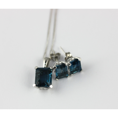 7 - A 9ct white gold and London blue topaz single stone pendant with a 9ct white gold neck chain and a p... 