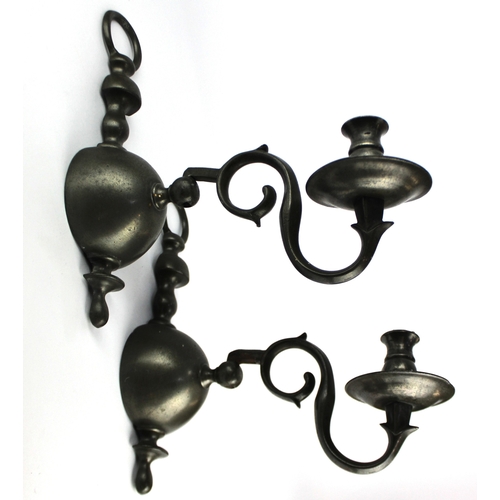 803 - A pair of heavy pewter wall sconces each with single candle holder on adjustable scroll stem, height... 