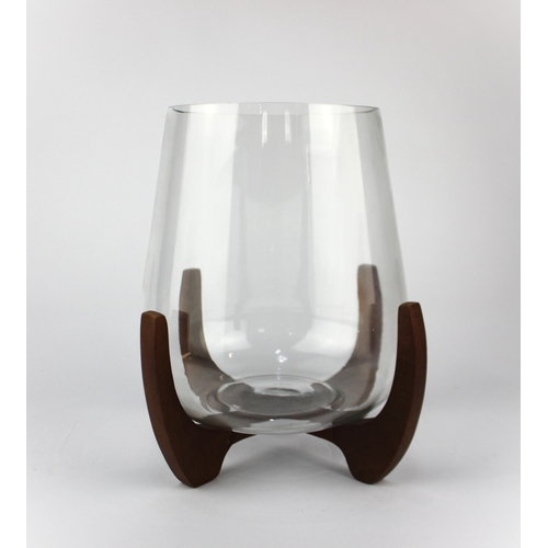 941A - A contemporary glass vase / large candle holder on stand, height overall 25cm... 
