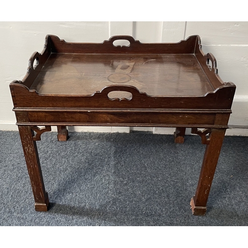 990 - A Georgian style mahogany silver table, 20th century, the raised shaped gallery incorporating four c... 