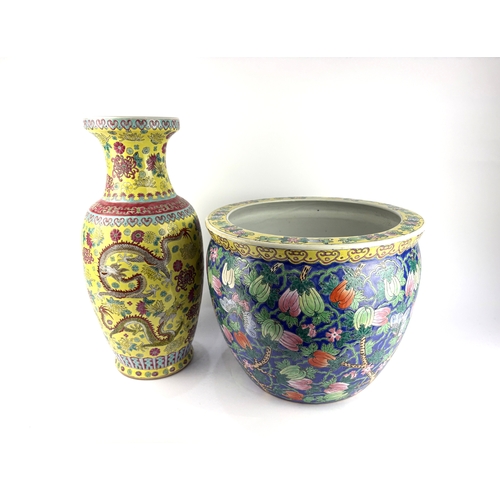 157 - A Chinese famille jaune porcelain vase, decorated in coloured enamels with dragons amidst stylised f... 