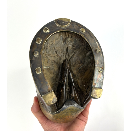 184 - A Victorian taxidermy desk top inkwell, with silver plated and brass mounts to the horses hoof, havi... 