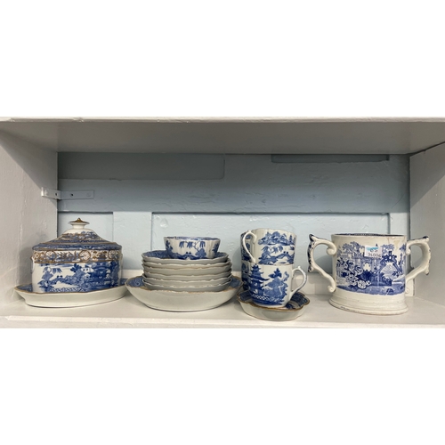 85 - A collection of 19th century blue and white willow pattern porcelain tea wares with gilt embellishme... 