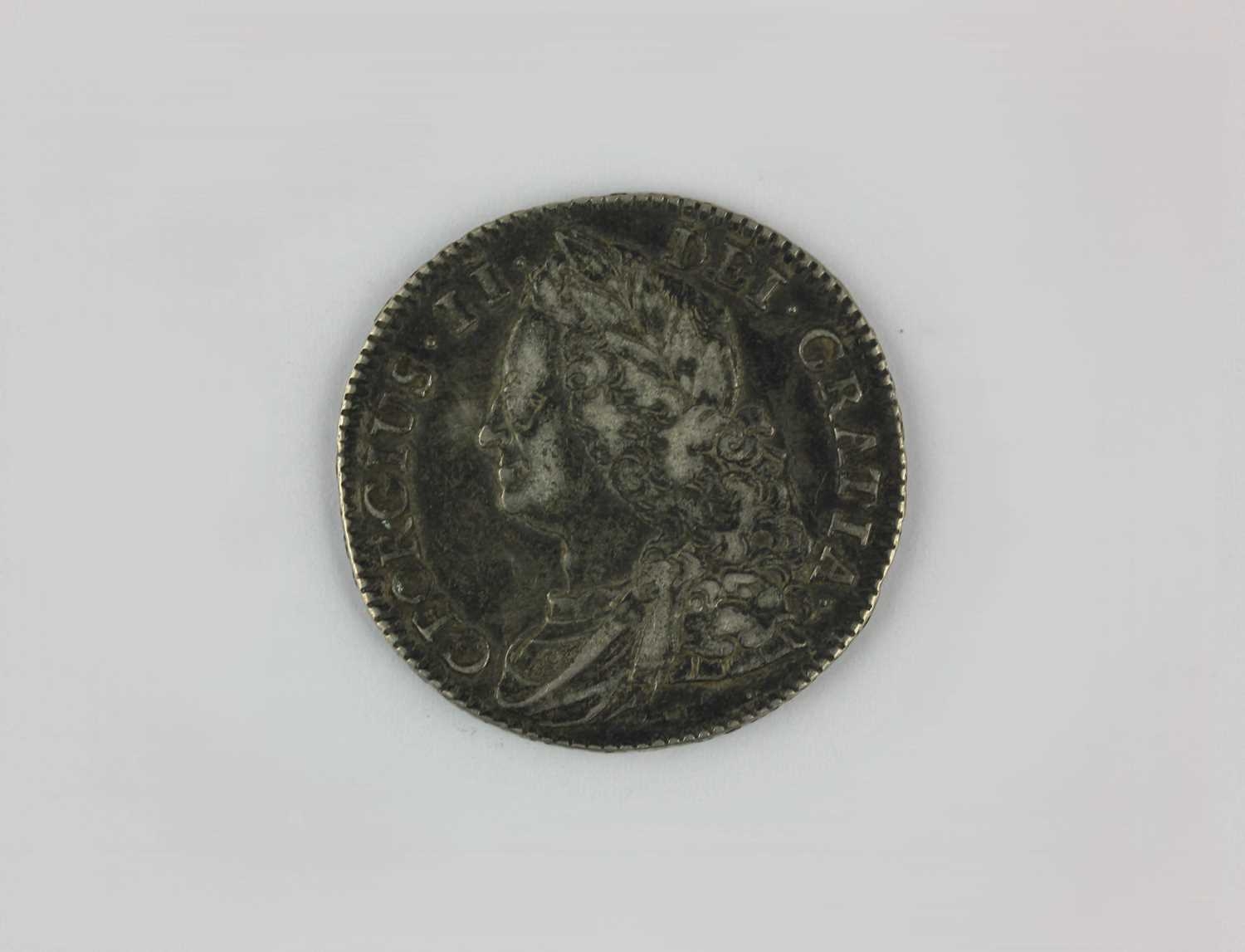 A George II half crown, old head, 1743, with roses to the angles of the ...