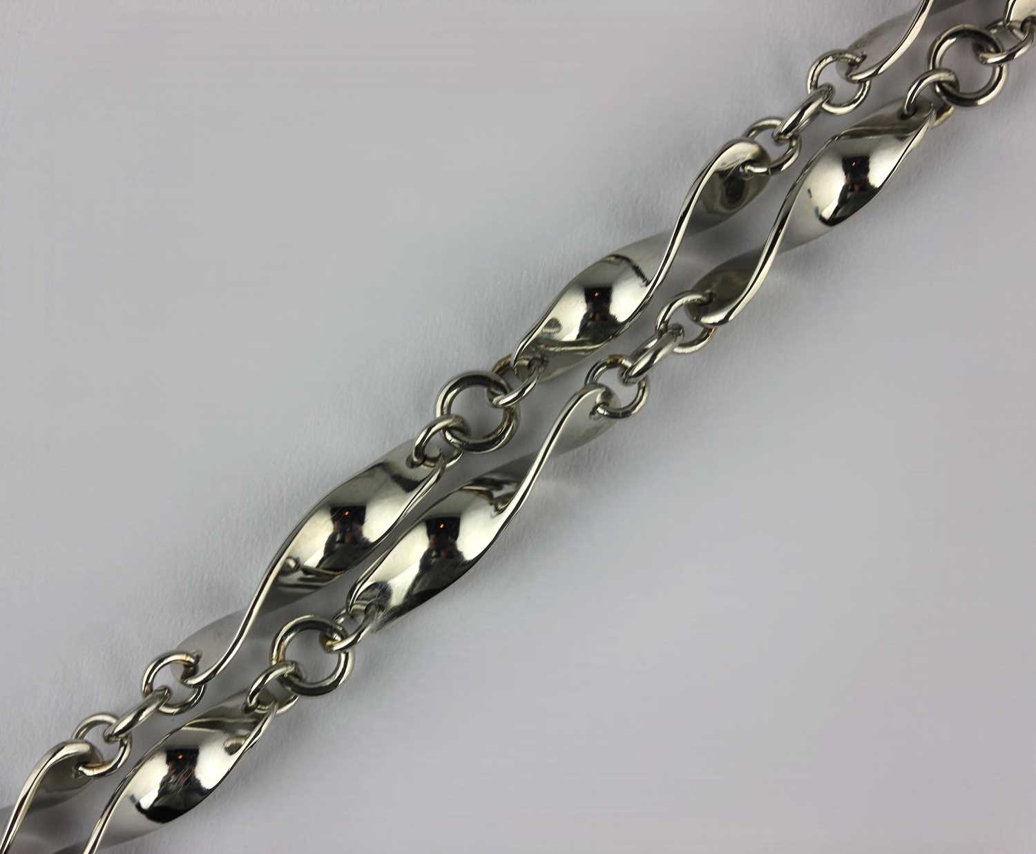 A platinum necklace in ribbon twist link design on a bolt ring clasp ...