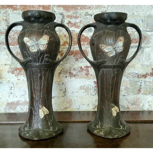 1 - A pair of Bretby Clanta faux bois two handled vases with applied dragonflies, butterflies & moth... 