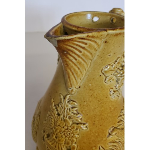 22 - A 19th century Brampton salt glazed stoneware baluster shaped jug, in relief with a hare to one side... 