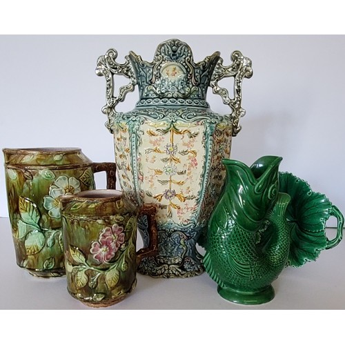 25 - A George Jones style large majolica jug with applied foliage and white five petal flowers, the handl... 