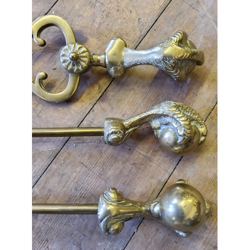 71 - A Victorian brass ball & claw companion set comprising poker, shovel, tongs and andirons