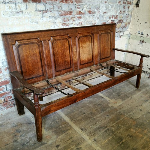 73 - An 18th century country house oak settle, four section walnut inlaid panelled back support, period i... 