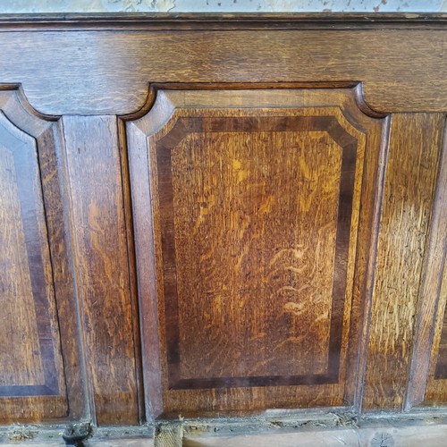 73 - An 18th century country house oak settle, four section walnut inlaid panelled back support, period i... 