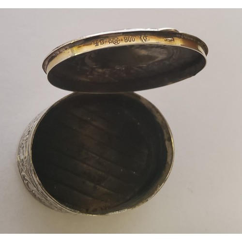 100 - A German silver late 19th/20th century snuff/pill box, moulded in relief with scolls, vacant cartouc... 