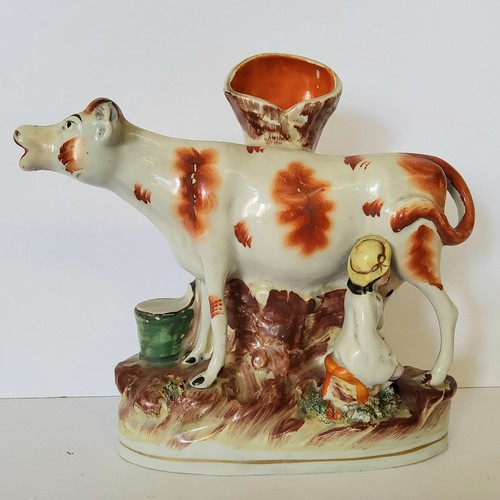 118 - A Victorian Staffordshire greyhound holding a hare c.1860; A Victorian Staffordshire flat back spill... 