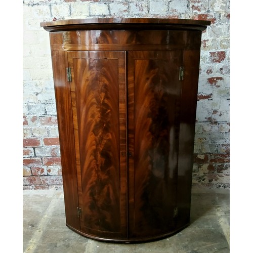 150 - A large George III flamed mahogany corner cupboard c.1800, 113cm high x 81cm wide x 57cm deep