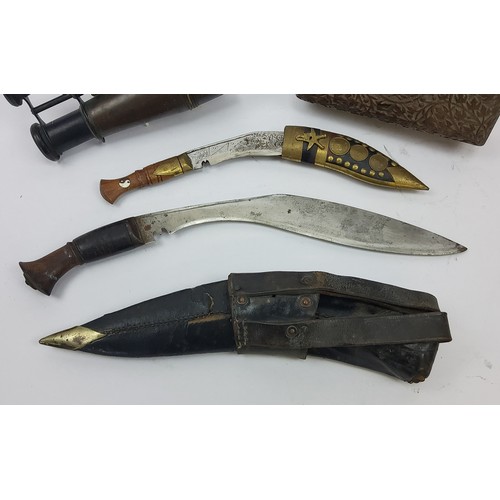 164 - Militaria- WWI -A first world war period Gurkha kukri and scabbard, the Kukri with a 34cm heavy... 