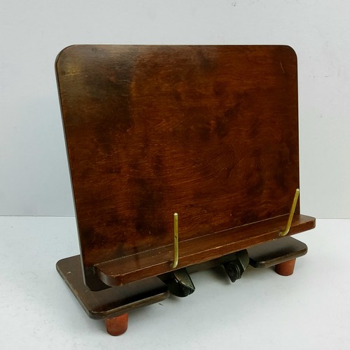 165 - A late Victorian /Edwardian mahogany book stand, stamped metal mount