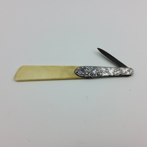 191 - A Victorian silver mounted ivory combination letter opener with folding steel knife blade, the decor... 