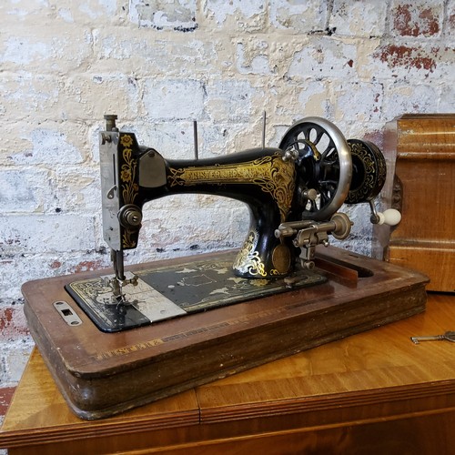 193 - An Edwardian Frister & Rossmann high arm T S variant form manual sewing machine, decorated with ... 