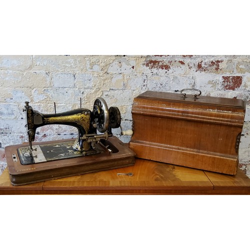 193 - An Edwardian Frister & Rossmann high arm T S variant form manual sewing machine, decorated with ... 