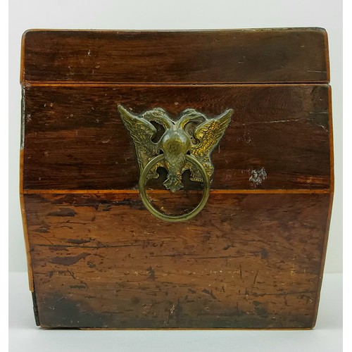 194 - An early 19th century walnut tea caddy, the brass double headed eagle escutcheons in the Empire tast... 