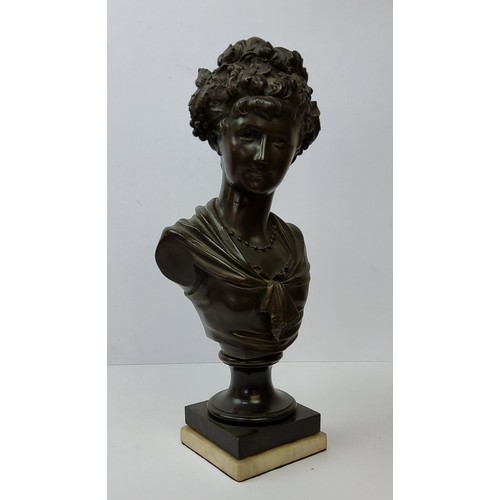 202 - A French pedestal bronze bust of a young woman with a garland of flowers in her hair, raised on carr... 