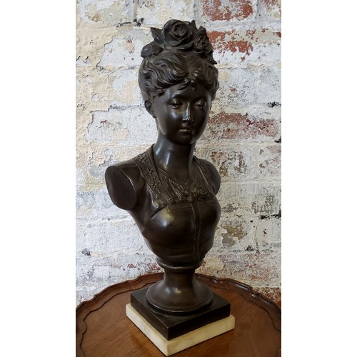 203 - A French pedestal bronze bust of a young woman with roses in her hair, raised on carrara marble base... 